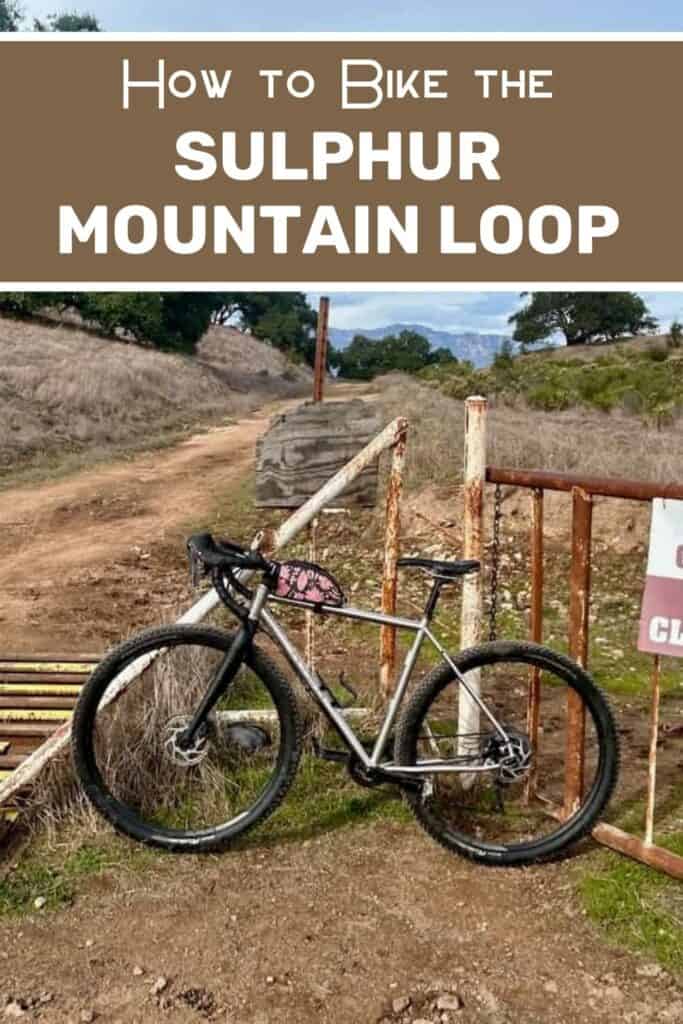 Pinnable image of gravel bike resting against cattle guard gate. Text reads "How to bike the Sulphur Mountain Loop"
