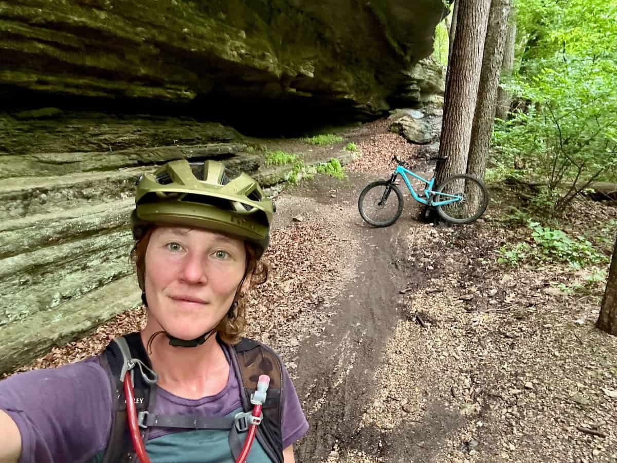 Woman mountain biker taking a selfie on the trail
