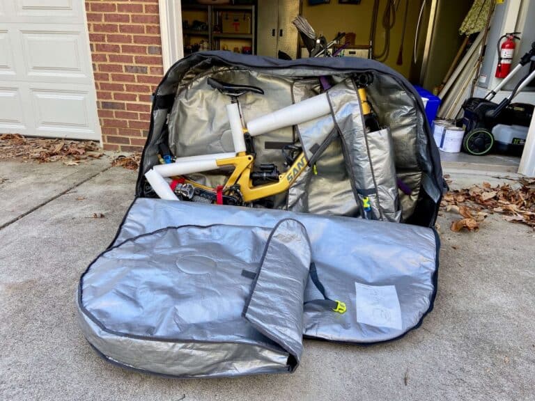 Mountain bike packed into a bike bag with side panel open
