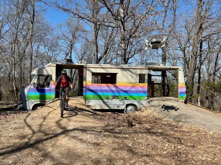 Woman riding bike through empty RV placed as ‘art’ in Bentonville