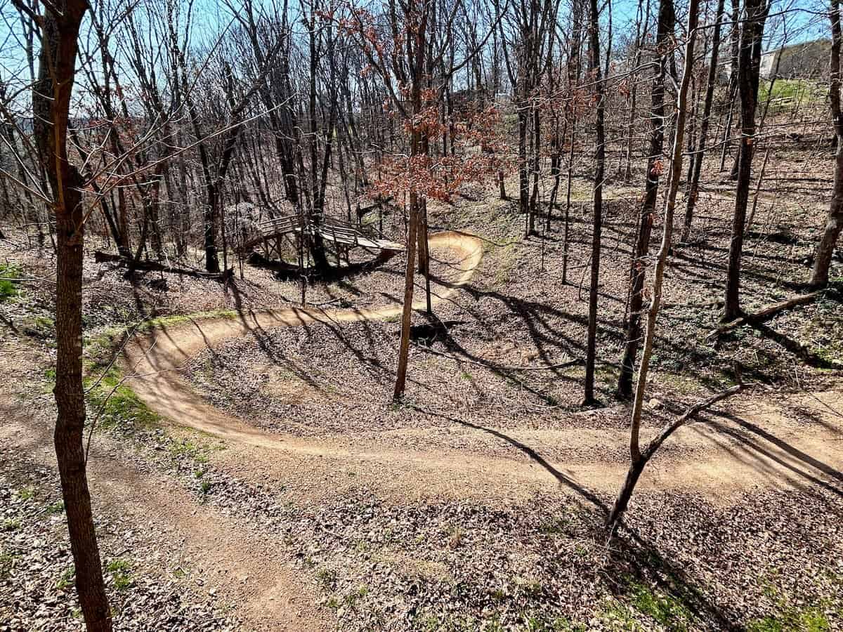 Flowing mountain bike trails through the woods with no leaves on the trees