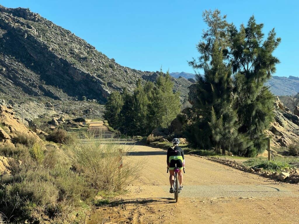 Cyclist on remote mountain dirt road