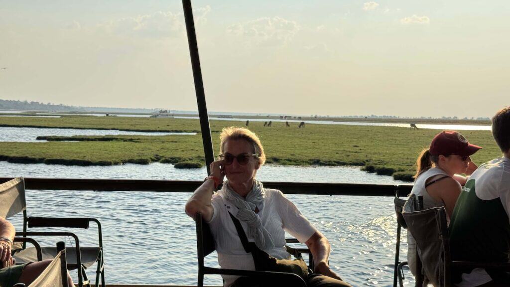 Woman relaxing on river cruise boat